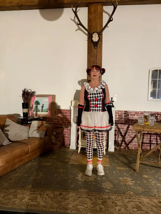 Performer in patterned costume on stage