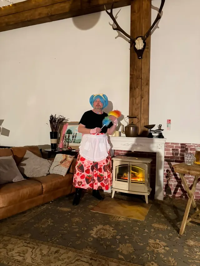 Pantomime dame performing on stage